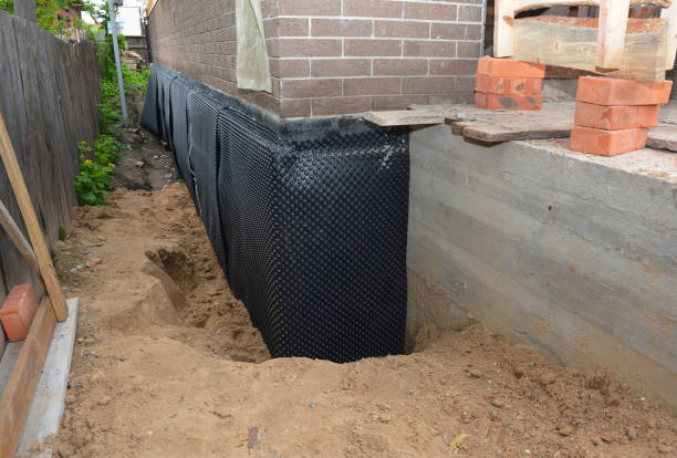 SJ Waterproofing Pros technician performing targeted Interior Drainage System assessment in Neshanic Station, NJ